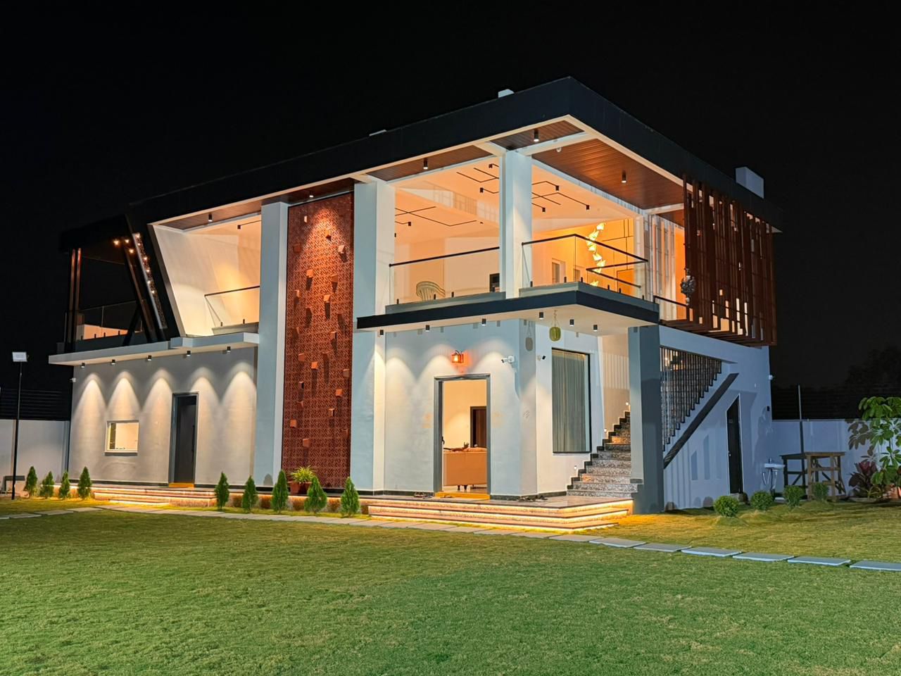 Grand sprawling green lawn at D Treatfarms private farmhouse Pocharam Hyderabad