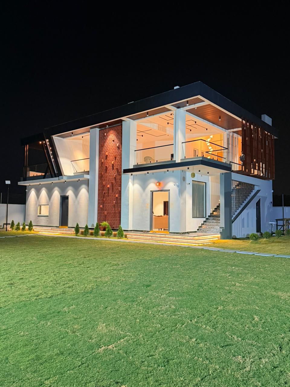 Lush green garden pathway at D Treatfarms private farmhouse Pocharam
