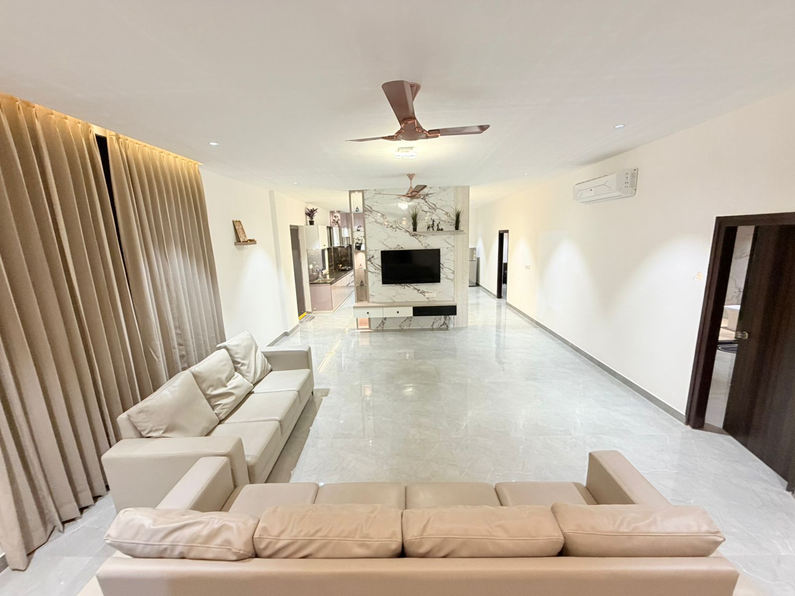 Premium open-plan living room inside D Treatfarms 4BHK farmhouse Hyderabad